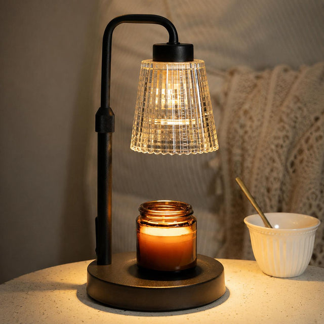 Decorative candle warmer lamp above a jar candle in a home fragrance setup. Illustrative reference for this article; exact model match not independently verified.