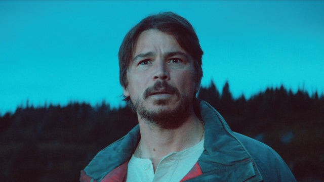 Josh Hartnett as Calvin Penney in Below, promotional still against a dusky coastal backdrop