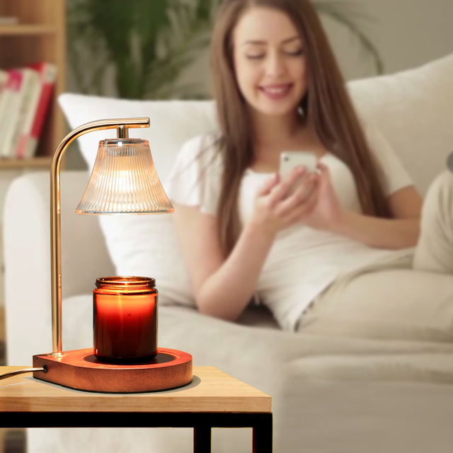 Candle warmer lamp with amber candle in a softly lit home setting; featured image, distinct from article body photos