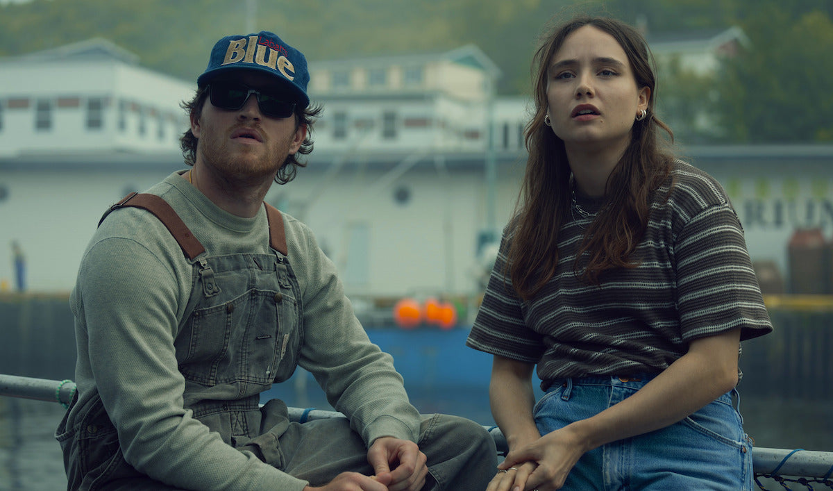 Below cast members near a Newfoundland harbor in a Netflix series still
