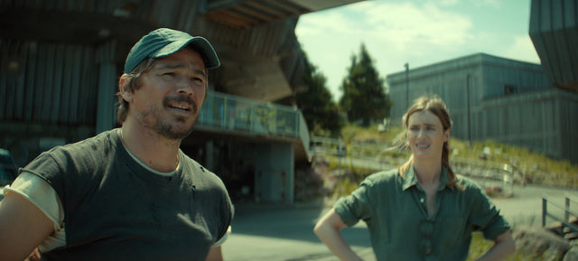 Below characters outdoors near industrial buildings