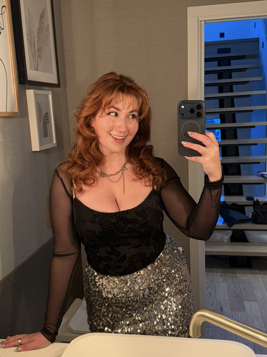 Isla Moon posing for a social media portrait in a black outfit