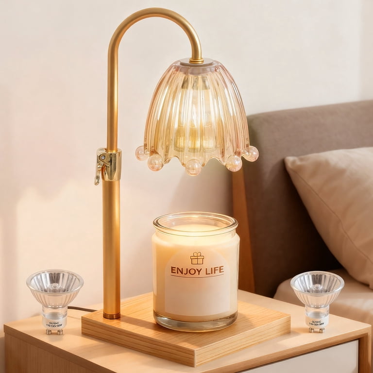Gold-tone adjustable candle warmer lamp with a glass shade and jar candle, shown as a similar product example. Illustrative reference for this article; exact model match not independently verified.