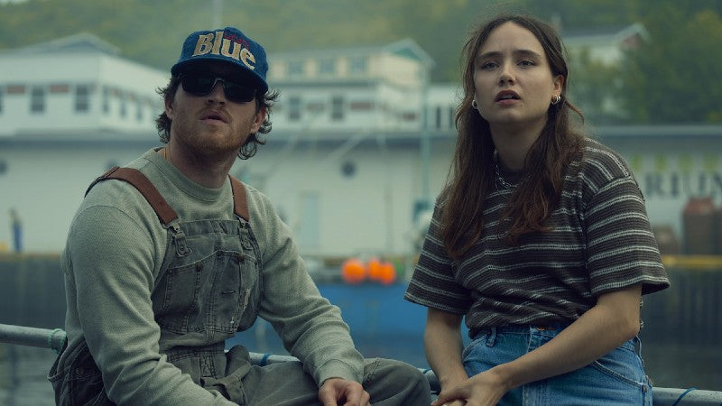 Calvin Penney and Fonda Howander share a tense moment on a dock in Below