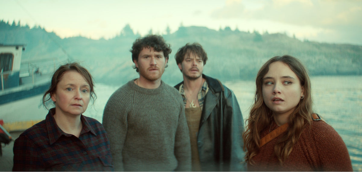 Below cast members on a misty Newfoundland waterfront