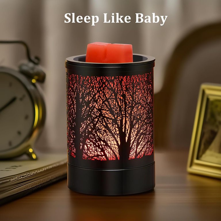 Enaroma Black Forest LED wax melt warmer glowing red beside a bedside clock