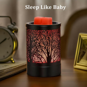Enaroma Black Forest LED wax melt warmer glowing red beside a bedside clock