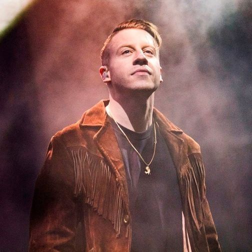 Macklemore performing during an earlier live performance, file photo