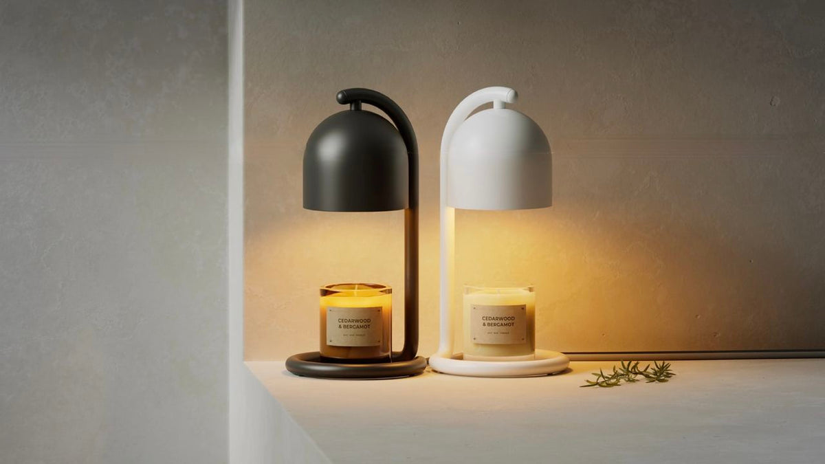 Black and white smart candle warmer lamps shown as modern home décor. Illustrative reference for this article; exact model match not independently verified.