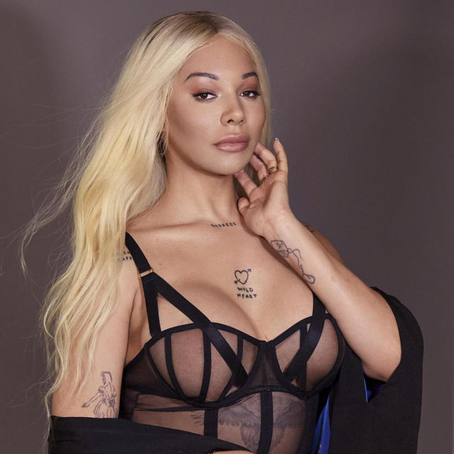 Adult fashion model in a black sheer lingerie campaign portrait, editorial image for OnlyFans News #11
