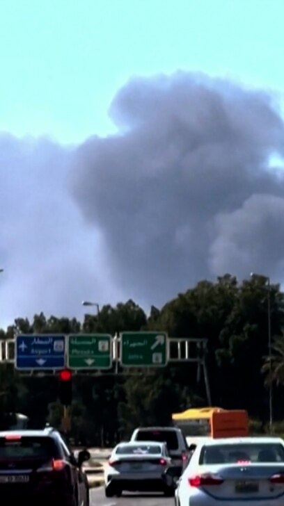 Smoke rises over a Riyadh highway near the airport after overnight air-raid alerts